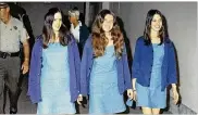  ?? GEORGE BRICH / AP 1970 ?? Charles Manson followers (from left) Susan Atkins, Patricia Krenwinkel and Leslie Van Houten walk to court to appear for their roles in the 1969 cult killings of seven people in Los Angeles.