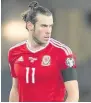  ??  ?? Wales players, including Gareth Bale, wore a black arm band