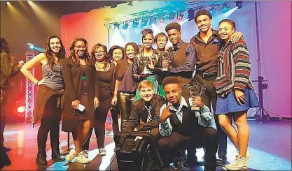  ?? SUBMITTED PHOTO ?? Members of the St. Charles High School a cappella group The Spartones stand onstage with their trophies at the SingStrong DC regional a cappella competitio­n April 2.