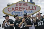  ?? JOHN LOCHER/THE ASSOCIATED PRESS ?? Members of a laborers union celebrate Monday in Las Vegas, Nev. NFL team owners approved the move of the Raiders to Las Vegas in a vote at an NFL football annual meeting in Phoenix.