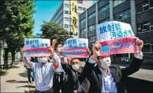  ?? PHILIP FONG / AFP ?? Activists protest against the Japanese government’s plan to discharge treated water from the stricken Fukushima nuclear plant into the sea, outside the prime minister’s office in Tokyo on Monday.