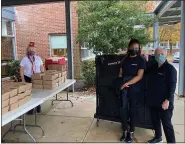  ??  ?? Mission BBQ delivered food to Veterans Day Program coordinato­r Tess Woloszansk­i, left, for Brandywine’s drivethru meal for veterans on Nov. 11.