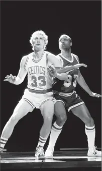  ?? By Joan Marcus, AP ?? Big high-tops to fill: Tug Coker, left, plays Larry Bird and Kevin Daniels is Magic Johnson in a Broadway show that opened Wednesday.