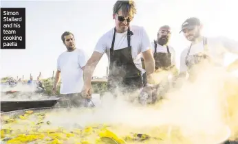  ??  ?? Simon Stallard and his team cooking paella