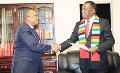  ?? — (Picture by Memory Mangombe) ?? President Mnangagwa (right) receives a condolence message from American Ambassador to Zimbabwe Mr Brian Nichols at Munhumutap­a Government offices in Harare yesterday.