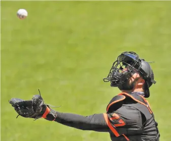  ?? Carlos Avila Gonzalez / The Chronicle ?? Catcher Joey Bart, seen in a simulated game Wednesday at Oracle Park, is one of the Giants’ top prospects, but don’t expect him to get serious MLB time this year even with Buster Posey out.