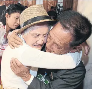  ?? THE ASSOCIATED PRESS ?? Lee Keum-seom, 92, weeps as she meets her 71-year-old son, Ri Sang Chol, for the first time since fleeing to the South during the Korean War.