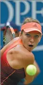  ?? SETH WENIG / AP ?? Simona Halep had to work hard to beat Victoria Azarenka in their US Open quarterfin­al on Wednesday.