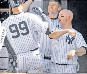  ?? Corey Sipkin ?? LAUNCH PARTY: Aaron Judge celebrates his 495-foot blast with Chase Headley (center) and Brett Gardner.