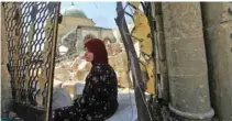  ?? - Reuters file photo ?? WAR RAVAGED: A displaced woman sitting near the ruined Grand Al Nuri Mosque in the Old City of Mosul, Iraq.