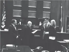  ??  ?? State Rep. Trey Kelley was joined by his wife and attorney Bill Lundy to be sworn in last week by Judge Dan Winn.