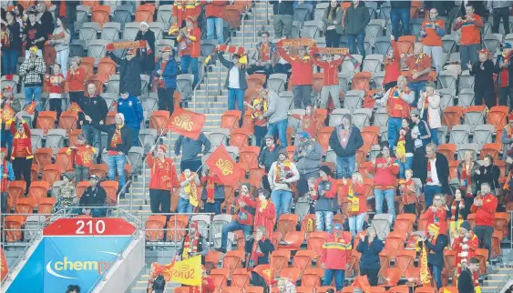  ?? Picture: JONO SEARLE/GETTY IMAGES ?? Suns fans get behind the team during the win over Fremantle on Saturday. Gold Coast now face a lengthy spell away from home.