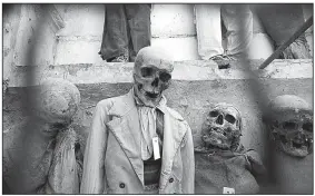  ?? Rick Steves’ Europe/DOMINIC ARIZONA BONUCCELLI ?? The Capuchin Crypt in Palermo, Sicily, displays mummified bodies — complete with clothing — intended to remind the living that life is temporary.
