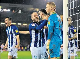  ??  ?? Let-off: Barry Bannan hails Wednesday keeper Cameron Dawson’s penalty save