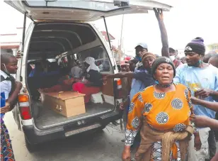  ?? — Picture: Tinai Nyadzayo ?? Gogo Eunice Makubva of Buhera (right) sobs after the commuter omnibus that was carrying her daughter’s coffin had a tyre puncture after the Mutare Municipal Police threw a spike at it along Mutare’s Herbert Chitepo Street last Friday.