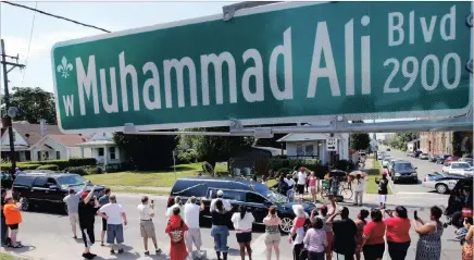  ?? PICTURE: REUTERS ?? A hearse carrying Muhammad Ali drives down Muhammad Ali Boulevard to Cave Hill Cemetery in Louisville, Kentucky, yesterday.