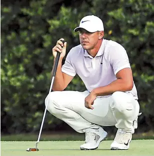  ??  ?? Making his move: Brooks Koepka of the United States lining up a putt on the 11th green during the third round. — AFP