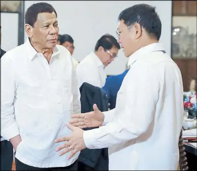  ??  ?? President Duterte chats with Interior and Local Government Secretary Eduardo Año prior to the start of the 43rd Cabinet meeting at Malacañang the other day.