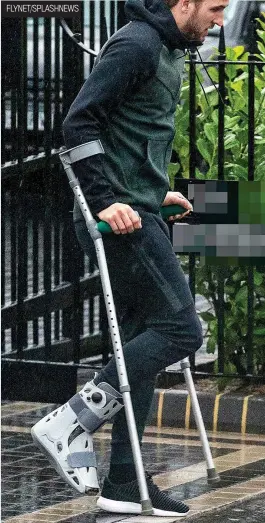  ??  ?? Hobbled: Kane was spotted on crutches in Essex yesterday