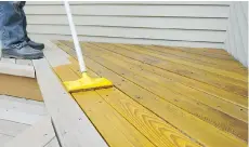  ??  ?? Touching up a peeling deck will likely require a good wash followed by a proper wood cleaner applied before you can add a new coat of stain.