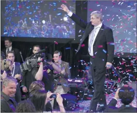  ?? MIKE RIDEWOOD GETTY IMAGES ?? Prime Minister Stephen Harper celebrates his win last May 2 in Calgary. Since then, observers say he hasn’t done much that looks and feels different from what Liberals might have done in similar circumstan­ces. There’s been no Harris-style Tory...
