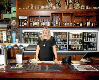  ??  ?? Butlers Reef bar manager Leeana Hughes; above right, owners Tracey Craig and Todd Burkett took over the pub 12 months ago and have been working to revamp it.