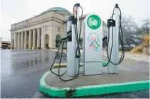  ?? STEVE HELBER/AP ?? An electric car charging station is positioned outside the Science Museum in February 2021 where Virginia state senators met for their legislativ­e session, in Richmond. Virginia Senate Democrats on Tuesday defeated several Republican efforts to repeal a so-called “clean cars” law that aims to reduce carbon pollution through the adoption of California’s stringent rules for vehicle emissions.