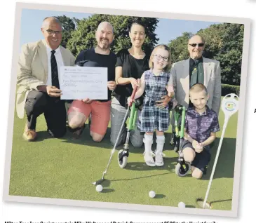  ??  ?? Milton Tree Iron Society captain Mike Walters and Patrick Garner present £500 to the Heriot family