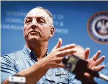  ?? Joe Raedle / Getty Images ?? Louisiana Gov. John Bel Edwards, a Democrat, has resolved to overhaul the tax code so it supples the state with enough income to meet its expenses. But the odds aren’t in his favor.