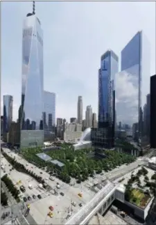 ?? AP PHOTO/MARK LENNIHAN ?? In this June 8, 2018 photo, 3 World Trade Center, second from right, joins its neighbors One World Trade Center, left, and 4 World Trade Center, right, next to the September 11 Memorial and Museum in New York.