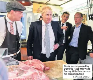  ?? GRAHAME LARTER ?? Boris, accompanie­d by Dominic Raab MP, visits Surrey Hills Butcherson his campaign trail