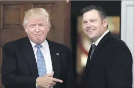  ?? Carolyn Kaster Associated Press ?? WHEN KRIS KOBACH met with Donald Trump in New Jersey, a photograph revealed portions of a Kobach document related to immigratio­n policy.