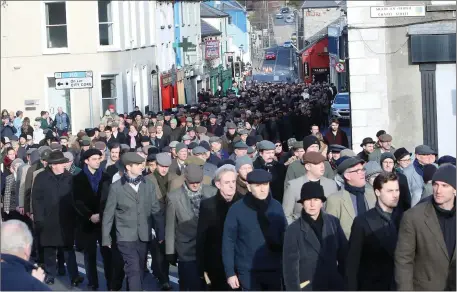  ?? Pics: ?? The silent march winds its way from City Hall along Teeling Streets to the war memorial on Pearse Road. Carl Brennan