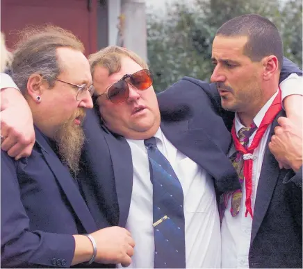  ??  ?? Mark Lundy is helped from the church after the funeral for his wife Christine and daughter Amber in Palmerston North, September 7, 2000.
Photo / File