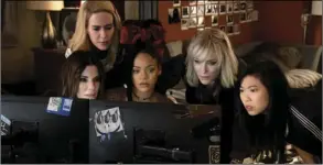 ??  ?? This image released by Warner Bros. shows (from foreground left) Sandra Bullock, Sarah Paulson, Rihanna, Cate Blanchett and Awkwafina in a scene from Ocean’s 8. BARRY WETCHER/WARNER BROS. VIA AP