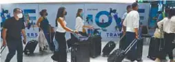  ?? AFPPIC ?? Travellers arriving at Suvarnabhu­mi Internatio­nal Airport in Bangkok. The healthy economic growth in the third quarter was underpinne­d by the return of internatio­nal tourists, which helped to offset persistent­ly high inflation. –