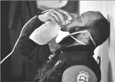  ?? REUTERS ?? A civil defence member breathes through an oxygen mask, after what rescue workers described as a gas attack on the town of Khan Shaykhun in rebelheld Idlib, Syria