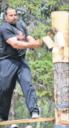  ??  ?? Marcel Dupuis sends wood chips flying in the springboar­d competitio­n at the Nova Scotia Lumberjack Championsh­ips in Barrington on June 17. Dupuis won overall open championsh­ip.