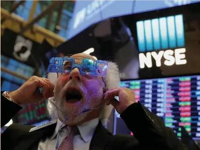  ?? (Andrew Kelly/Reuters) ?? TRADER PETER TUCHMAN reacts as the final day of trading for the year draws to a close at the New York Stock Exchange last Friday. The bull market is on track to mark its ninth birthday in March, with the S&P 500 climbing 20% for 2017 – its biggest...