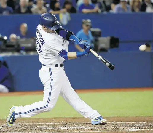  ?? Tom Szczerbows­ki
/ Gett
y Imag
es ?? Josh Donaldson’s solo home run in the third inning tied the game for Toronto and was the 40th of the season for him. Jose
Bautista and Kevin Pillar also his homers and R.A. Dickey won the 100th game of his career on Friday.