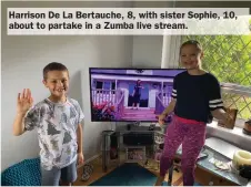  ??  ?? Harrison De La Bertauche, 8, with sister Sophie, 10, about to partake in a Zumba live stream.