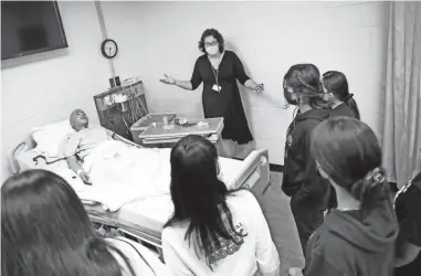  ?? PHOTOS BY SARAH PHIPPS/THE OKLAHOMAN ?? April Holliday gives high school students in the basic nursing high school class a tour of nursing lab rooms at the Metro Technology Center in Oklahoma City, Wednesday.