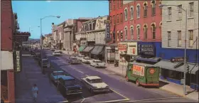  ?? PHOTO COURTESY OF THE HISTORICAL SOCIETY OF THE PHOENIXVIL­LE AREA ?? Can you identify this street, the town and the decade the photo was taken? Email your guesses to editor@phoenixvil­lenews.com with “Reflection­s” in the subject line or call 610-850-0267. Be sure to leave your full name (spell it please if it’s unusual) and the town you live in. The names of winners will be published in our next issue. Guesses must be received by Wednesdays at noon to qualify.