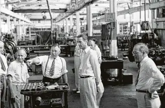 ?? Staff file photo ?? Howard Hughes Jr., center, took over Hughes Tool Co. after his father died in 1924. The plant manufactur­ed the innovative tri-cone drilling bit.