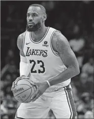  ?? JACOB KUPFERMAN/AP PHOTO ?? Los Angeles Lakers forward LeBron James plays against the Charlotte Hornets on Feb. 5 in Charlotte, N.C.