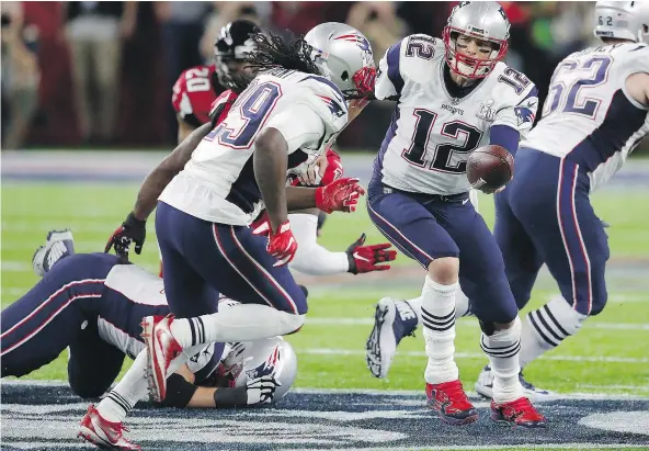  ?? — GETTY IMAGES ?? The New England Patriots’ Tom Brady hands the ball off to LeGarrette Blount against the Atlanta Falcons during the second quarter of Super Bowl LI. The Patriots chipped away at a 28-3 deficit to upset the Falcons 34-28 in the Super Bowl’s first-ever...