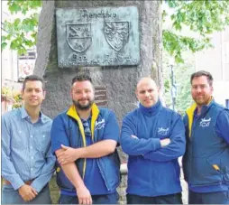  ??  ?? Cllr Bill Barrett with T-Cat team members Tom Judd, Daniel Conlin and John Halliday by the Friendship Stone