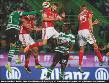  ??  ?? Record breakers...Benfica (in red) beat Lisbon rivals Sporting to set a new Portuguese league best of 17 consecutiv­e away wins