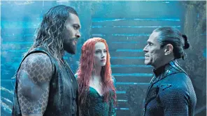  ??  ?? Three’s a crowd: Jason Momoa, Amber Heard and Willem Dafoe in James Wan’s Aquaman