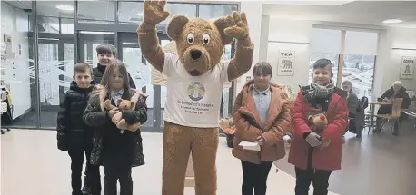  ??  ?? Benedict Bear with pupils from North View Academy.